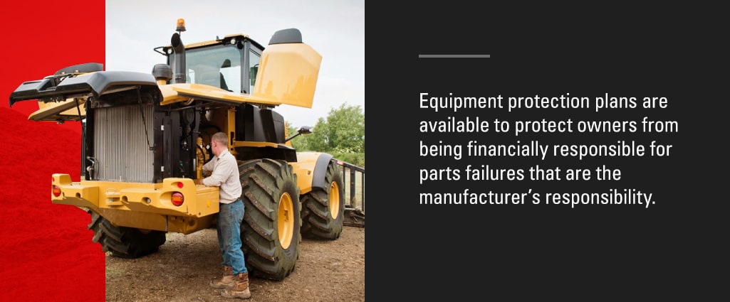 man working from the ground on a wheel loader